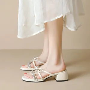 Elegant off-white block heel sandals for women with rhinestone bow and pearl dress
