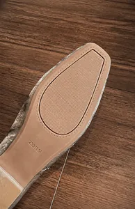 Macro shot of durable anti-slip rubber sole with texture and size marking 230