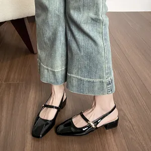 Elegant black patent leather Mary Jane sandals with square toe and gold buckle detail