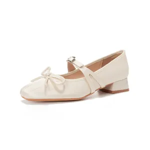 Creamy white Mary Jane shoes with square toe, bow detail and stable chunky heels