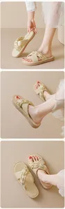 Detail of cream-colored platform slides featuring a stylish cross-knotted褶皱 texture upper