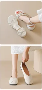 Detail of silver block heel sandals with crystals and textured beige flat shoes