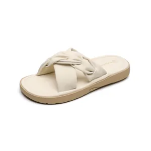 Elegant beige woven flat slide sandals for women with a comfortable thick non-slip sole