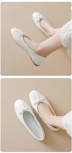 Detailed close-up of a white ballet flat featuring a leather texture and bow detail
