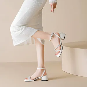 Elegant white rhinestone block heel sandals with ankle strap and pearl decorations