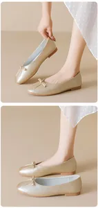 Detail of elegant champagne gold ballet flats with bow decoration and soft metallic finish