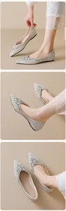 Macro detail of square-toe flats featuring luxury pearls, rhinestones, and floral crystals