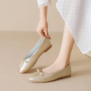 Champagne gold ballet flats with bow detail and pleated square toe in elegant style