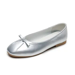 Silver ballet flats for women with metallic finish and bow tie detail on flat rubber sole