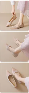 Detail of nude pointed-toe flat shoes with glossy toe cap and matte finish texture