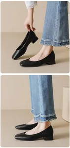 Detail of black square toe chunky heel pumps with a stylish side view on feet