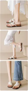 Detailed close-up showing beige knotted straps and platform wedge sole of women's sandals
