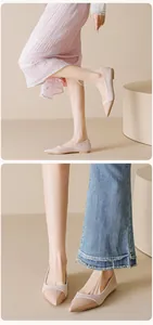 Detail of pointed-toe ballet flats in nude pink showing mixed suede and patent textures