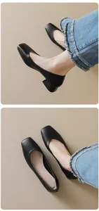 Detail of black lychee grain leather square toe mid-heel pumps with vintage thick heels