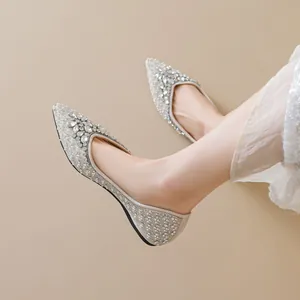 Elegant champagne gold pointed-toe flat shoes with luxury pearls and sparkling rhinestones