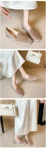 Detailed close-up of champagne velvet ballet flats with sparkling rhinestones and beads