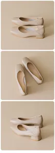 Detail view of beige square-toe mid-heel pumps with smooth premium leather texture