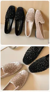 Detailed view of square-toe velvet flats featuring shimmering beads and rhinestones