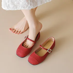 Elegant red Mary Jane ballet flats with matte leather and suede patchwork detail