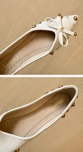 Detailansicht der beigen spitzen flachen Schuhe mit Lederstruktur und Schleife mit Nieten