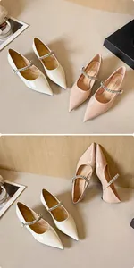 Detail view of pointed-toe Mary Jane shoes with rhinestone straps in beige and pink