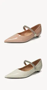 Detail of pointed-toe Mary Jane flats with sparkling rhinestones and pearl straps