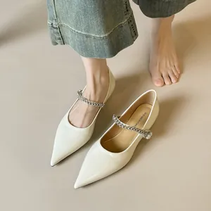 Elegant beige pointed-toe Mary Jane flats with sparkling rhinestone and pearl strap