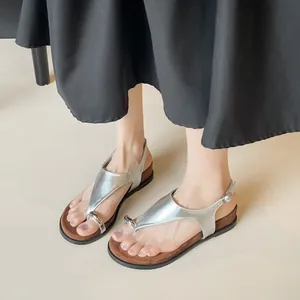 Silver metallic thong sandals for women with thick platform soles and toe ring detail