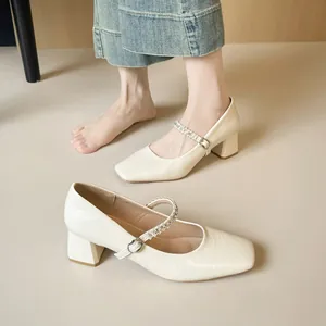 Elegant off-white Mary Jane block heels with rhinestones and square toe design