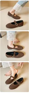 Close-up of brown suede Mary Jane flats with silver buckle and lace-edge denim pants