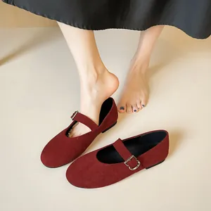 Vintage burgundy suede Mary Jane flats with round toe and adjustable buckle strap