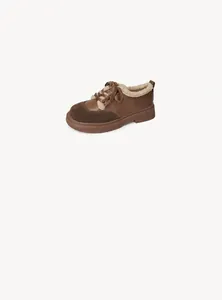 Detail of warm faux shearling lining and 4cm platform sole on brown vintage winter shoes
