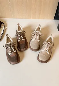 Detail view of winter platform shoes with plush lining in coffee and beige colors