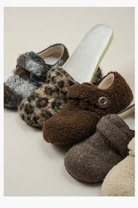 Detail of plush fleece shoes with leopard print and removable insoles for warmth