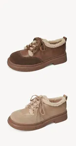Close-up of winter platform oxford shoes with warm faux fur lining and lace-up detail