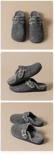 Detail of grey felt clogs showing stitched edges, metallic buckle, and plush footbed