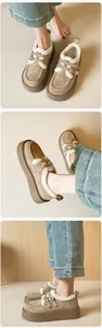 Detailed views of platform fur-lined camel suede boots with stylish double metal buckles