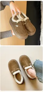Detail view of brown suede platform mule with warm fleece lining and metal buckle strap