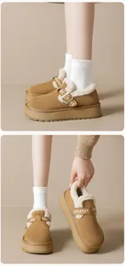 Close-up of thick platform snow boots with warm faux fur lining and embroidered buckle strap