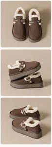 Macro shot of brown suede platform snow boots with warm faux fur lining and buckle