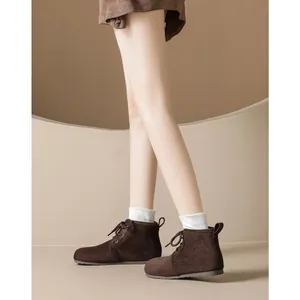 Women's dark brown suede flat ankle boots with warm fleece lining and lace-up closure