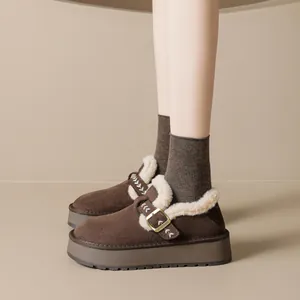 Brown suede platform snow boots with warm white faux fur lining and buckle detail