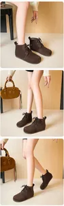 Vue détaillée de bottines à lacets en daim marron foncé avec bout rond et design rétro