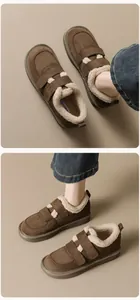 Detail view of brown suede platform boots with plush fleece lining and velcro straps
