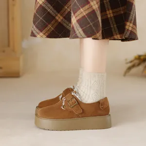 Women's platform fleece-lined snow boots with warm suede upper and metal buckle detail