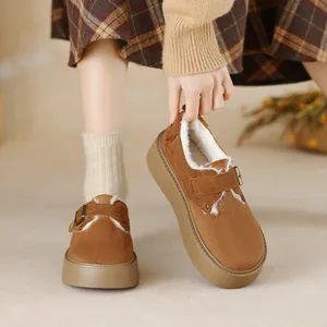 Brown suede platform snow boots with warm faux fur lining and adjustable metal buckles
