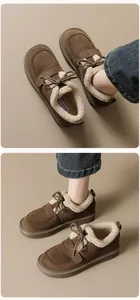 Nahaufnahme brauner Wildleder-Schneestiefel mit dickem Kunstfellfutter und Kordelzug