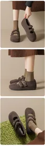 Detailed texture view of brown wool Mary Jane shoes with elegant gold metal buckles