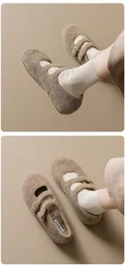 Macro detail of brown felt Mary Jane shoes featuring warm plush lining and gold buckles
