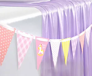 Detail of purple pleated table skirt and cartoon rocking horse triangular party bunting